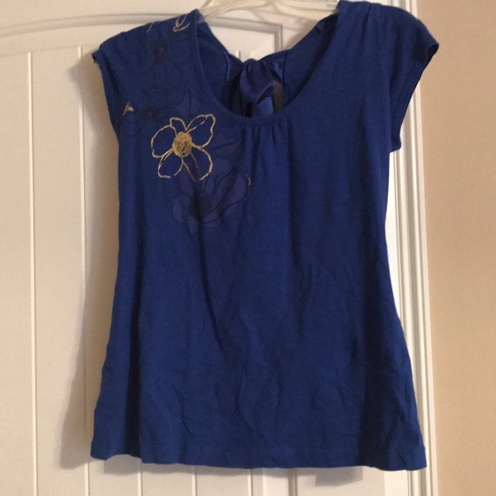 Blue shirt with floral pattern on one side